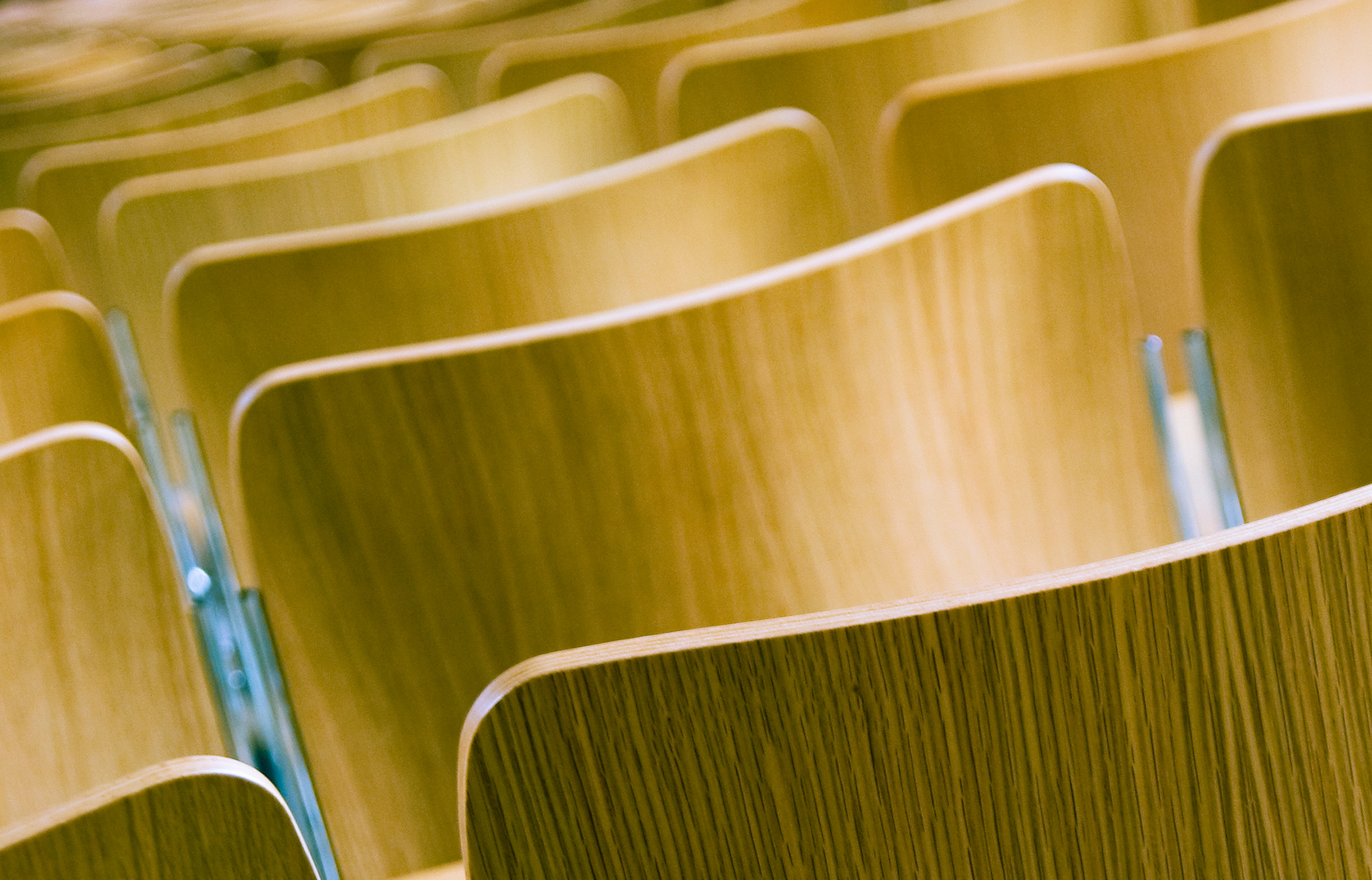 Close-up view of lecture hall chairs