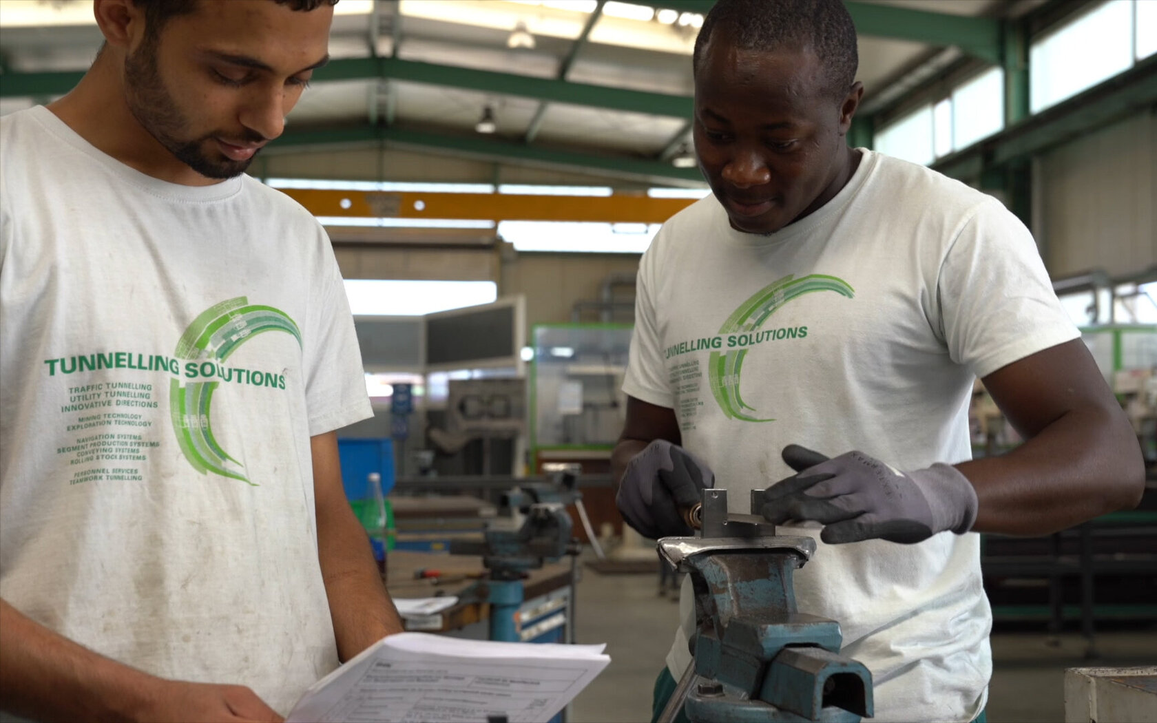 two students during their work at a workbench