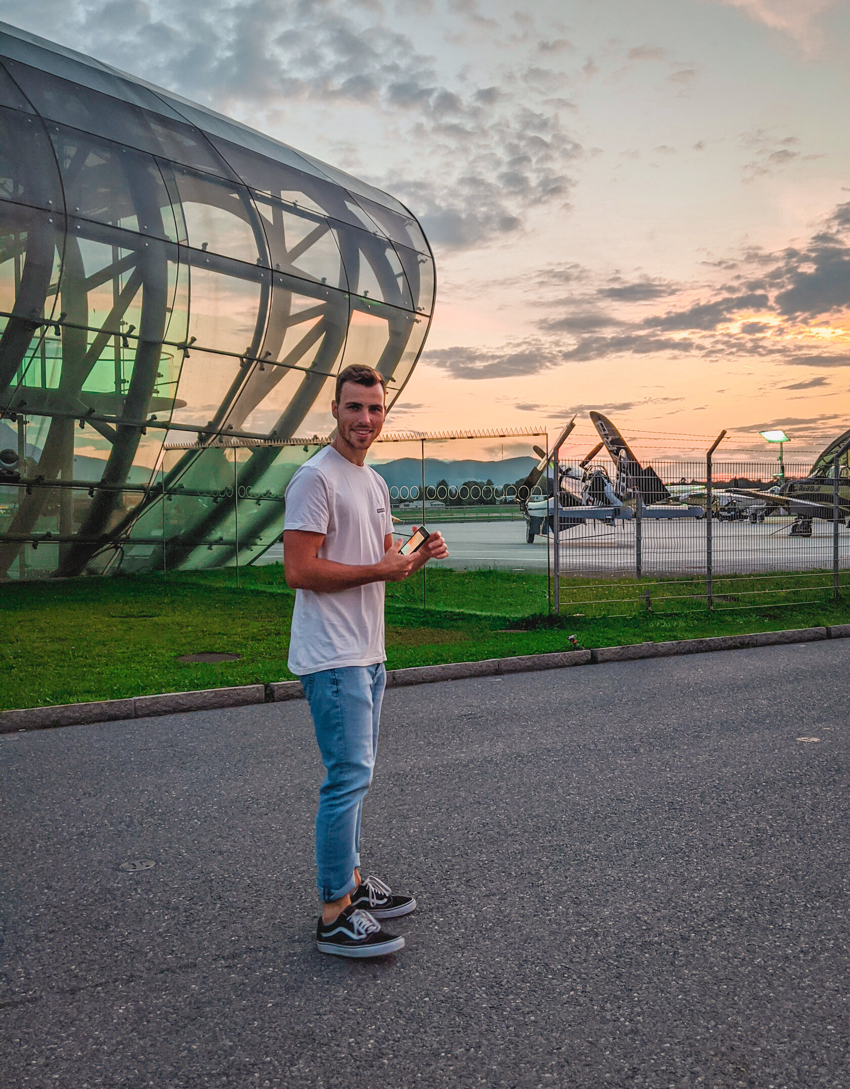 the student standing outside an airfield