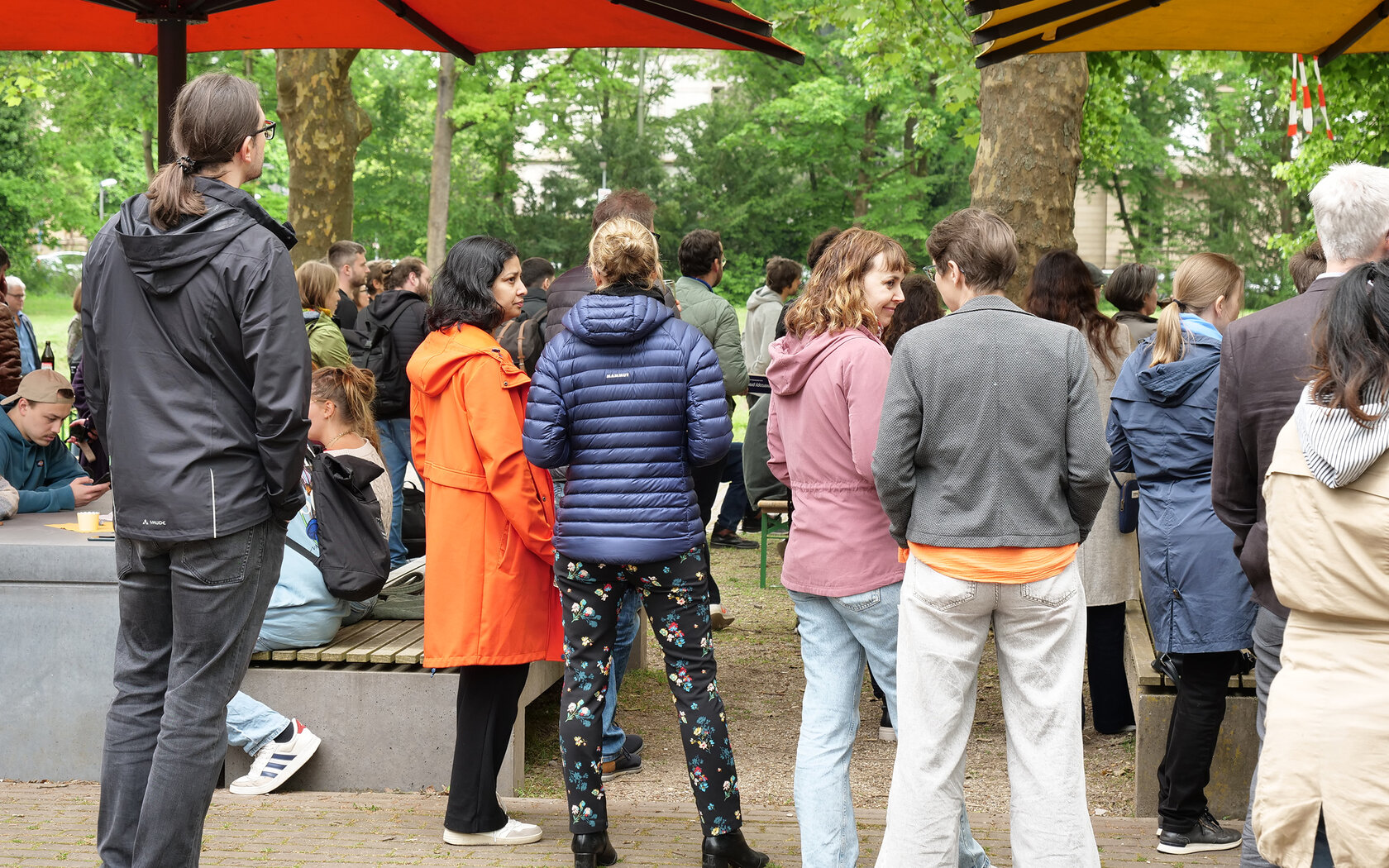 HKA members socializing under the campus sunshades
