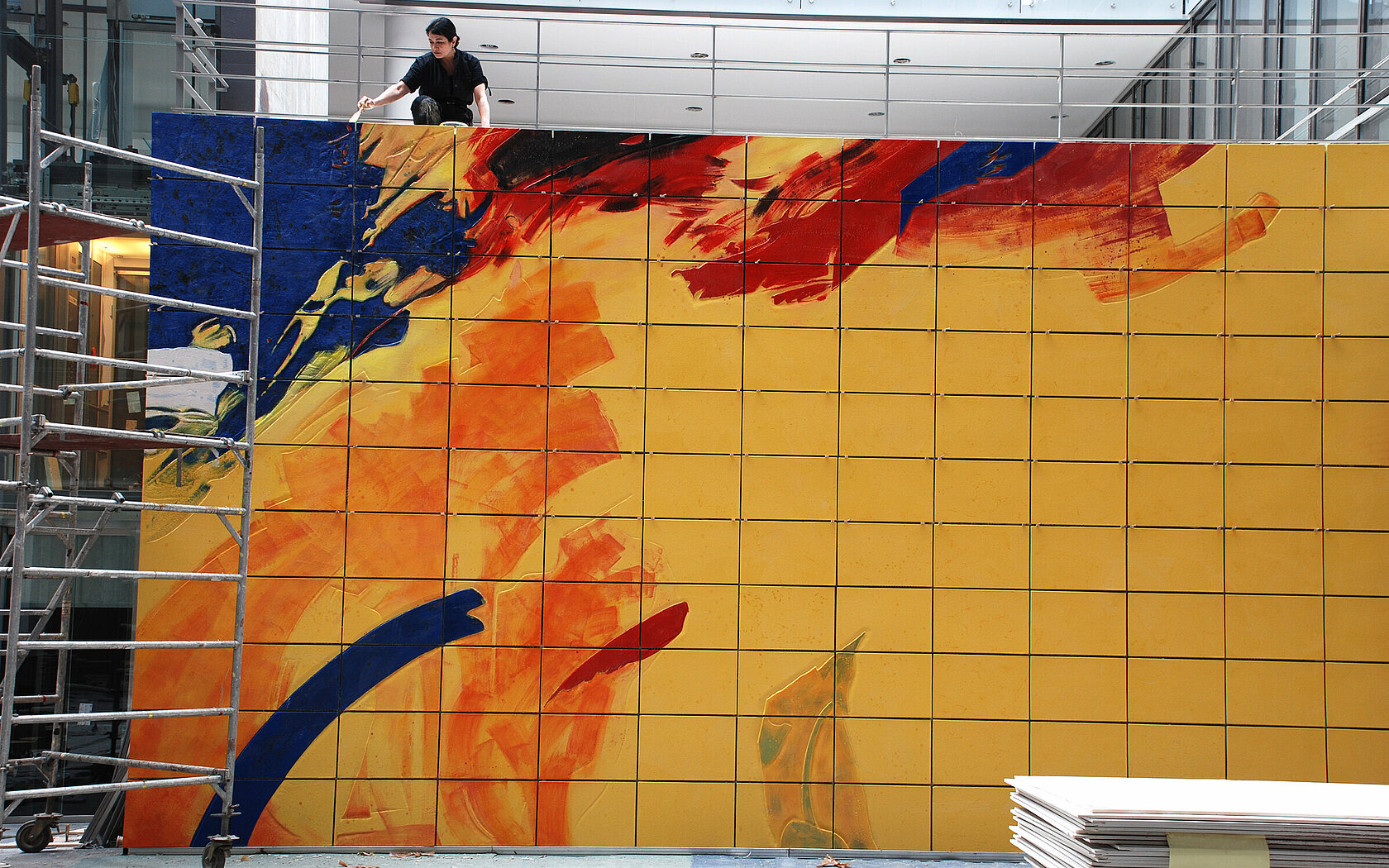 artist painting abstract mural