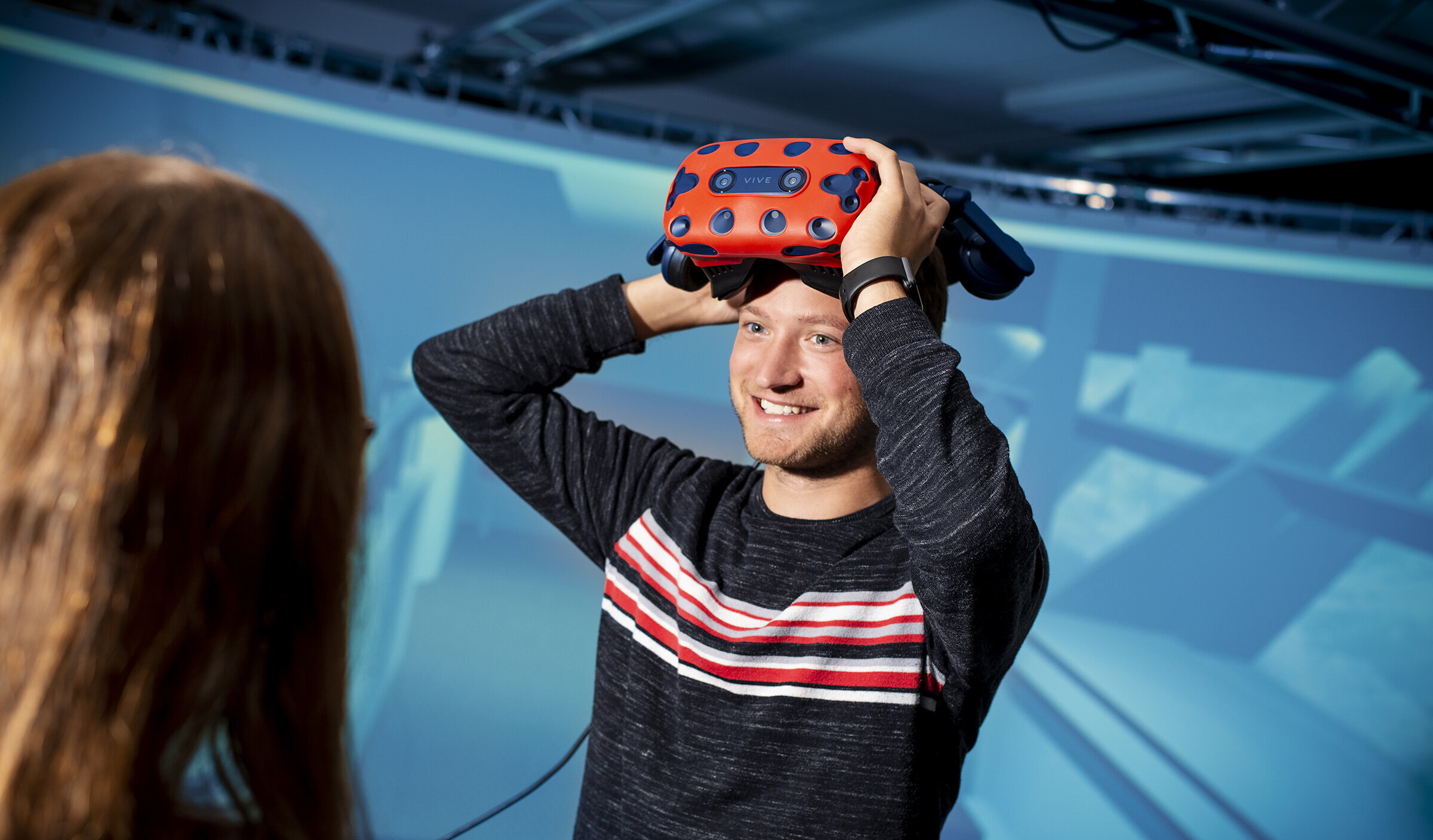 student putting on VR goggles