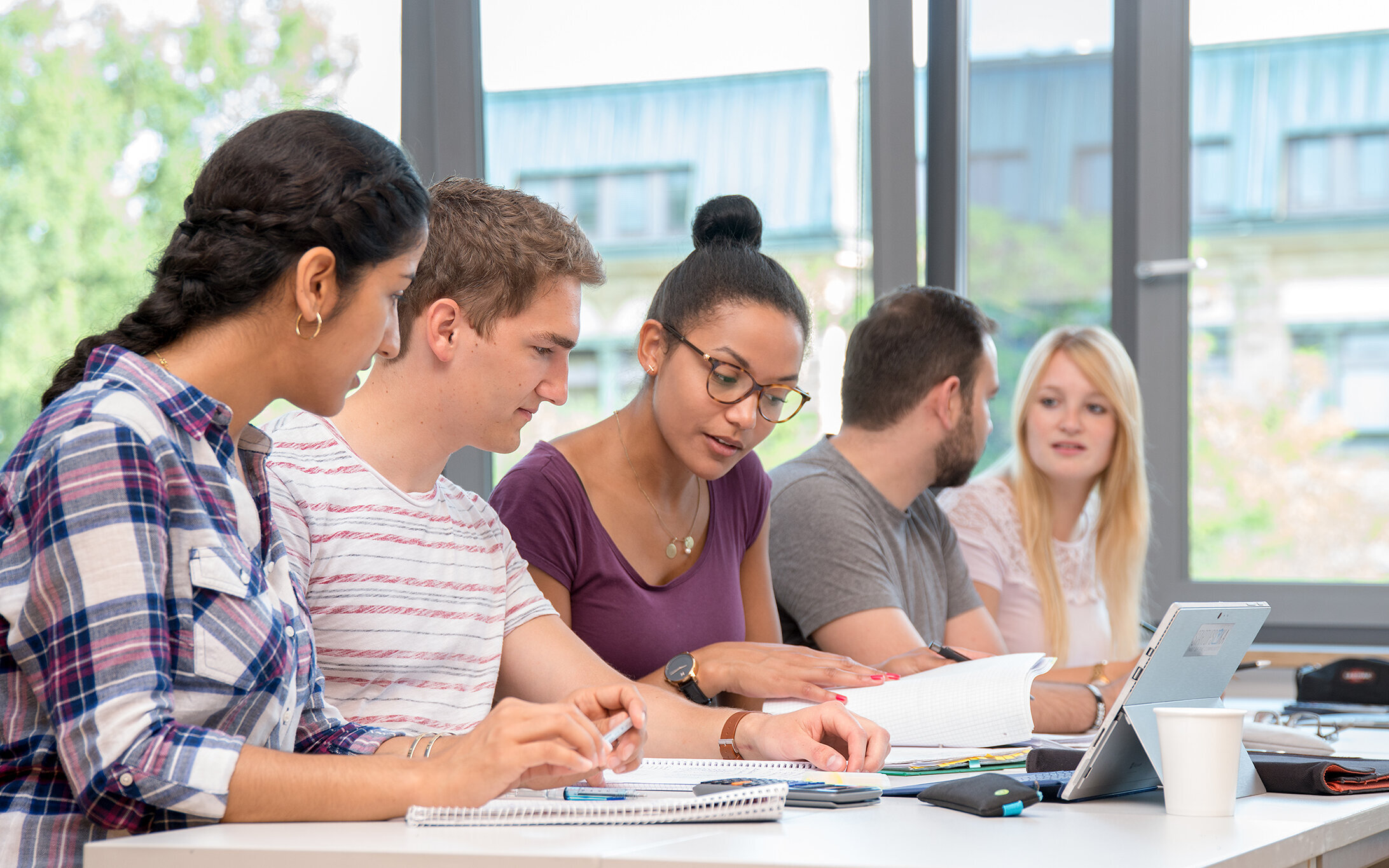 a group of students sitting in a seminar room