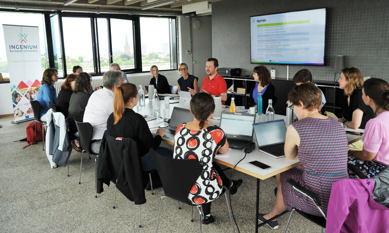 Discussion of several peopl at a conference table