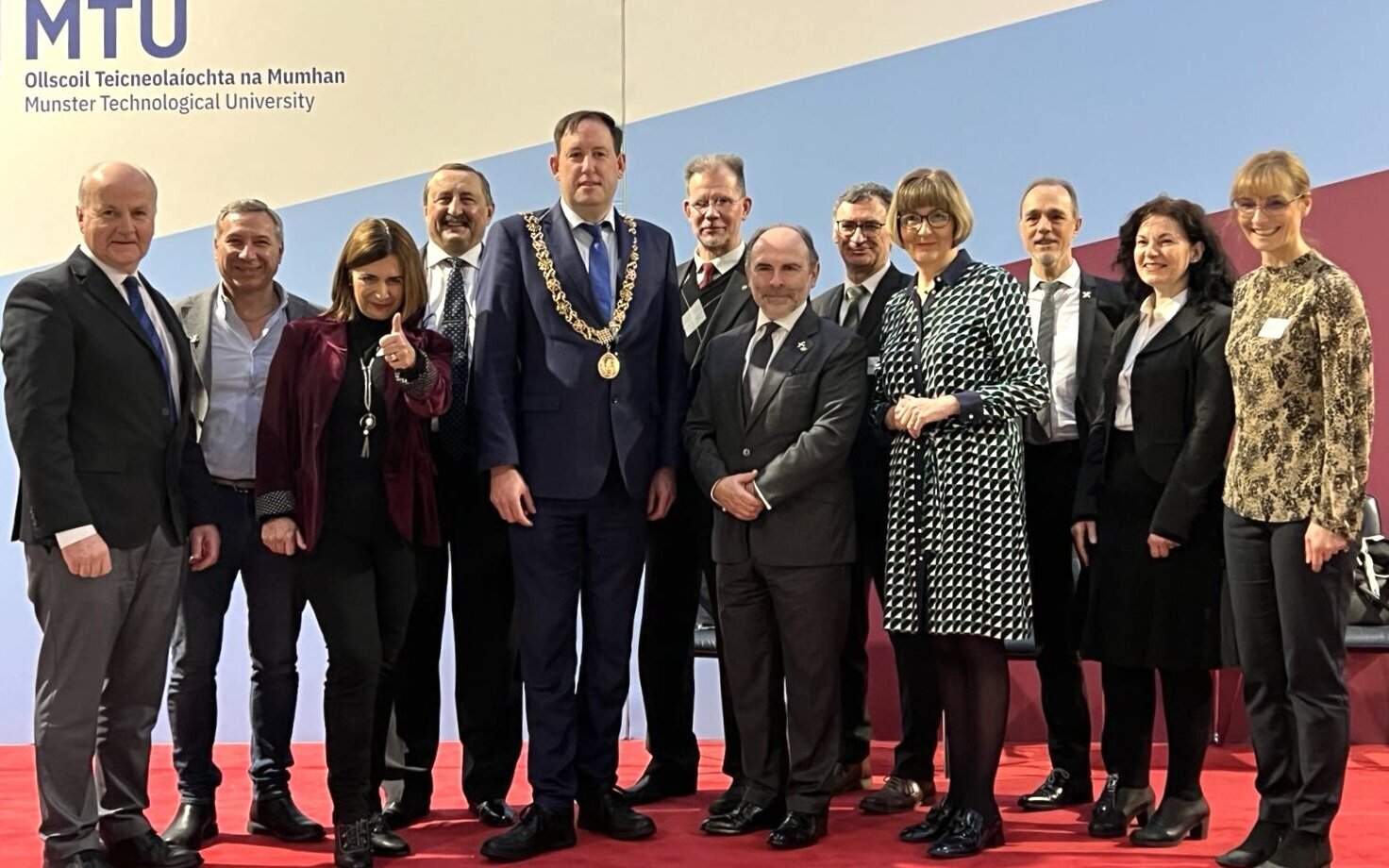 group of university dignitaries in front of INGENIUM billboard group of university dignitaries in front of INGENIUM billboard