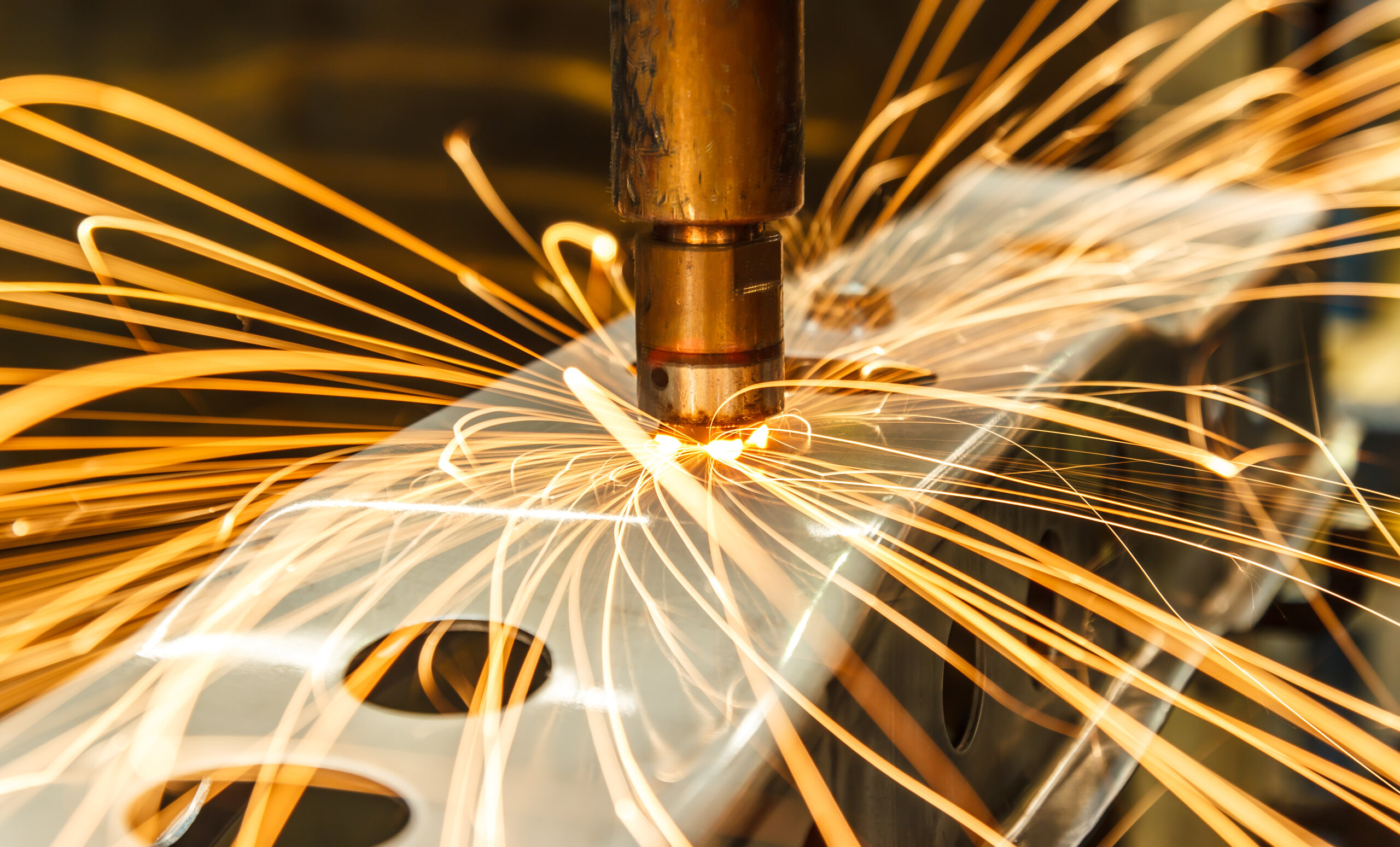 Close-up of machine tool, with sparks