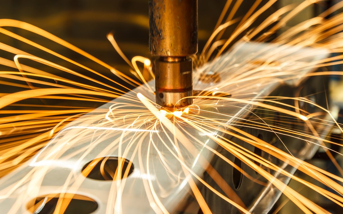 Close-up of machine tool, with sparks