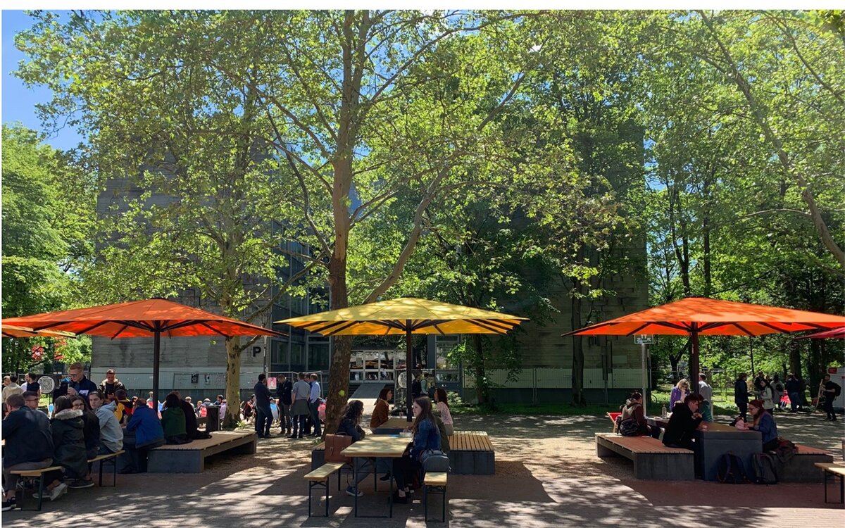 campus center with seating under colorful parasols