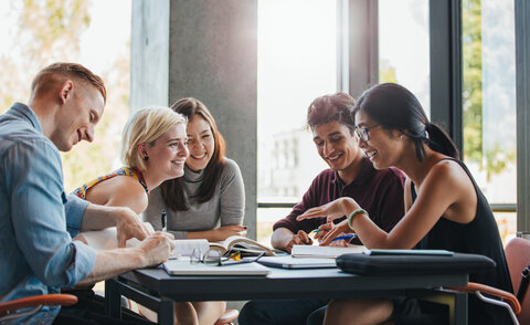 Students studying in college library