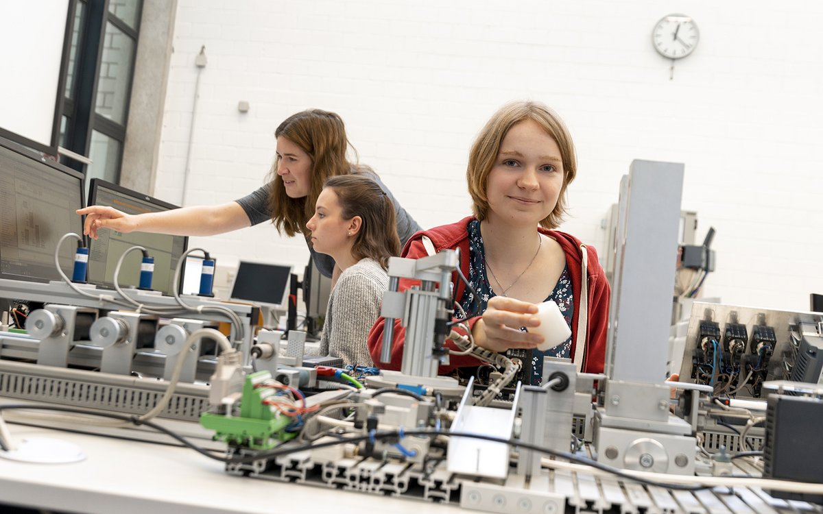 young women working with machines at the lab