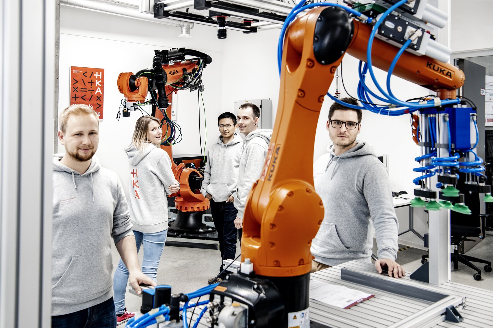 IAF facilities Industrial Robot Laboratory, the iRAS staff around an industrial robot