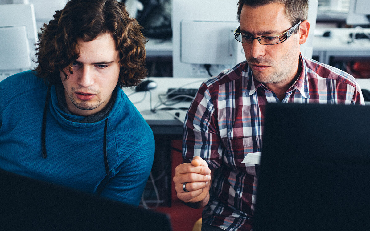 two engineers working at PCs
