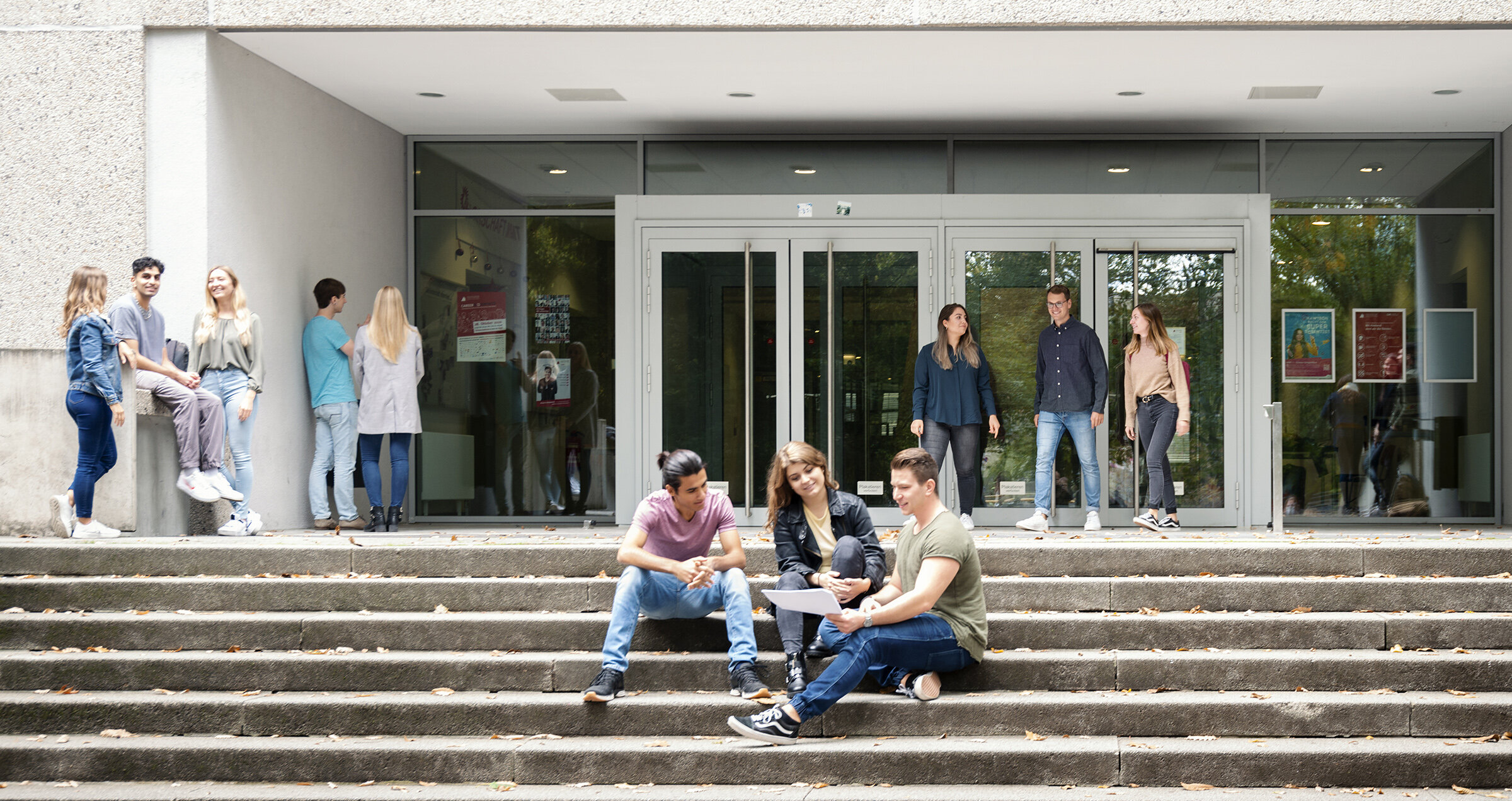 Groups of students in front of building at HKA campus