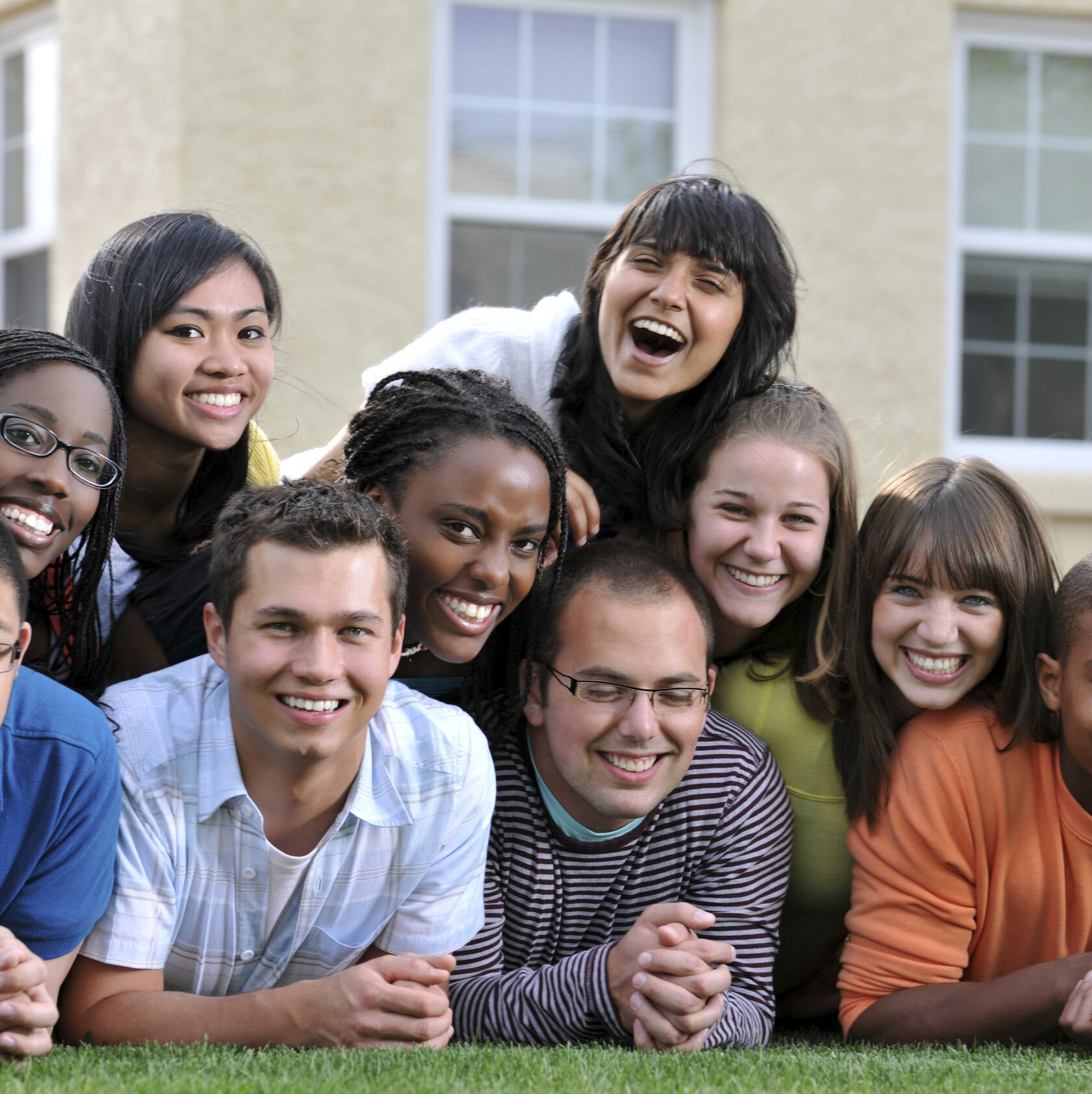 mixed group of laughing young people mixed group of laughing young people