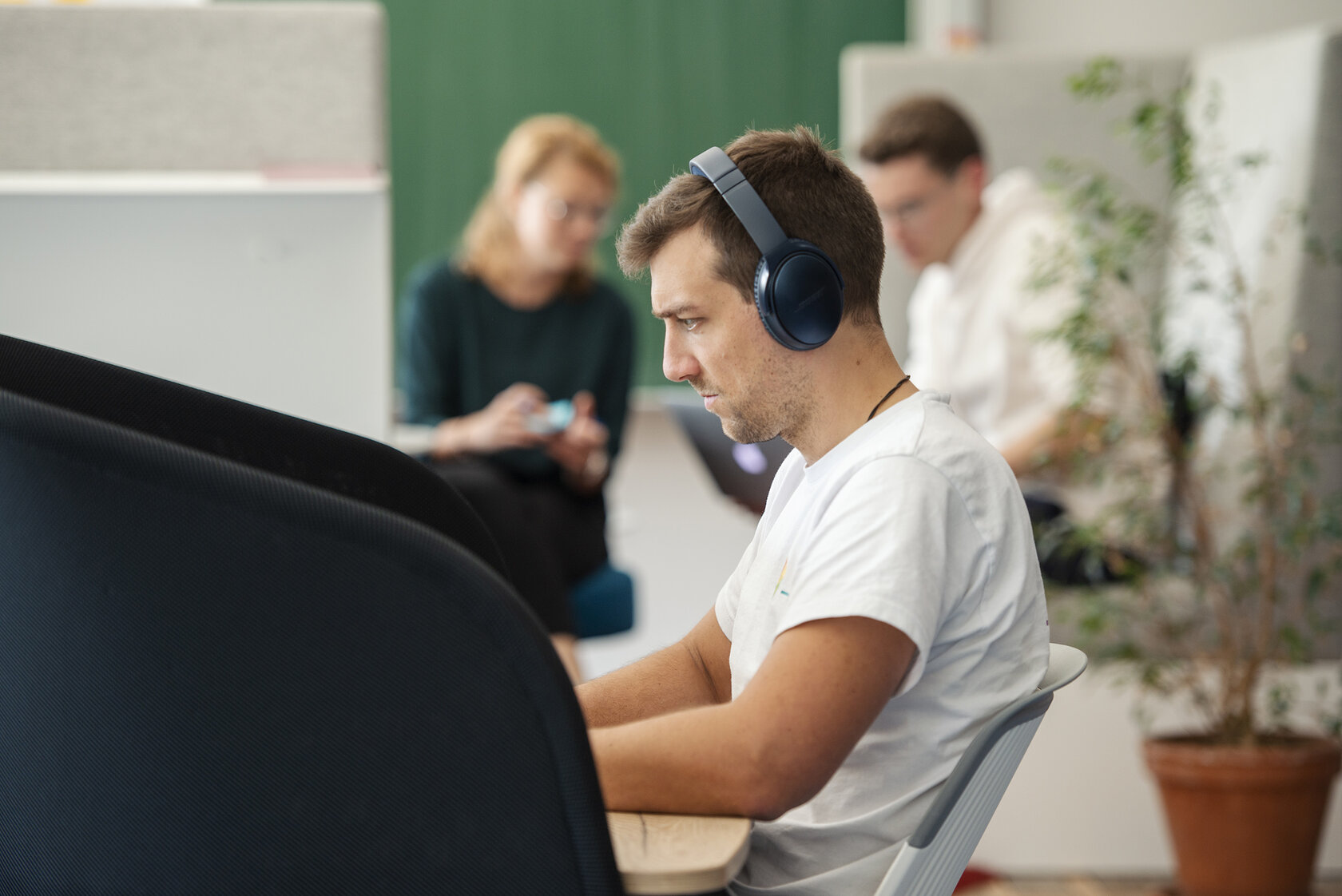 student working at a computer workspace