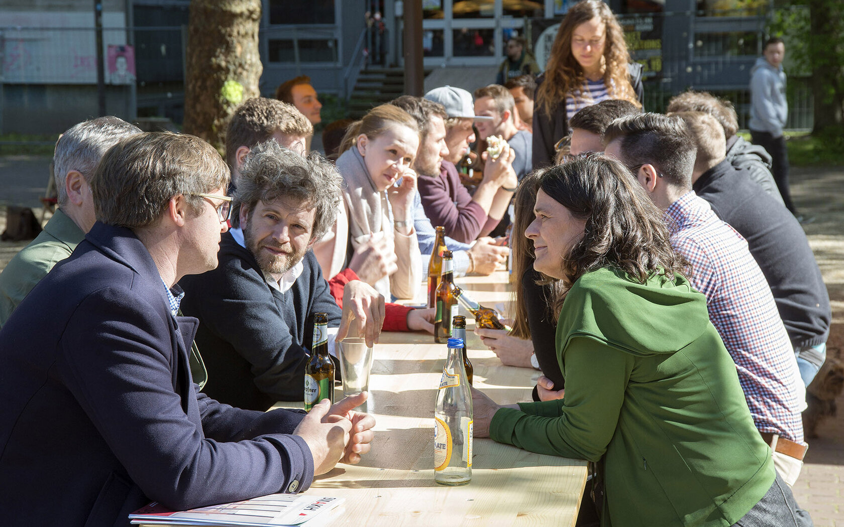 people sitting at beer table and chatting