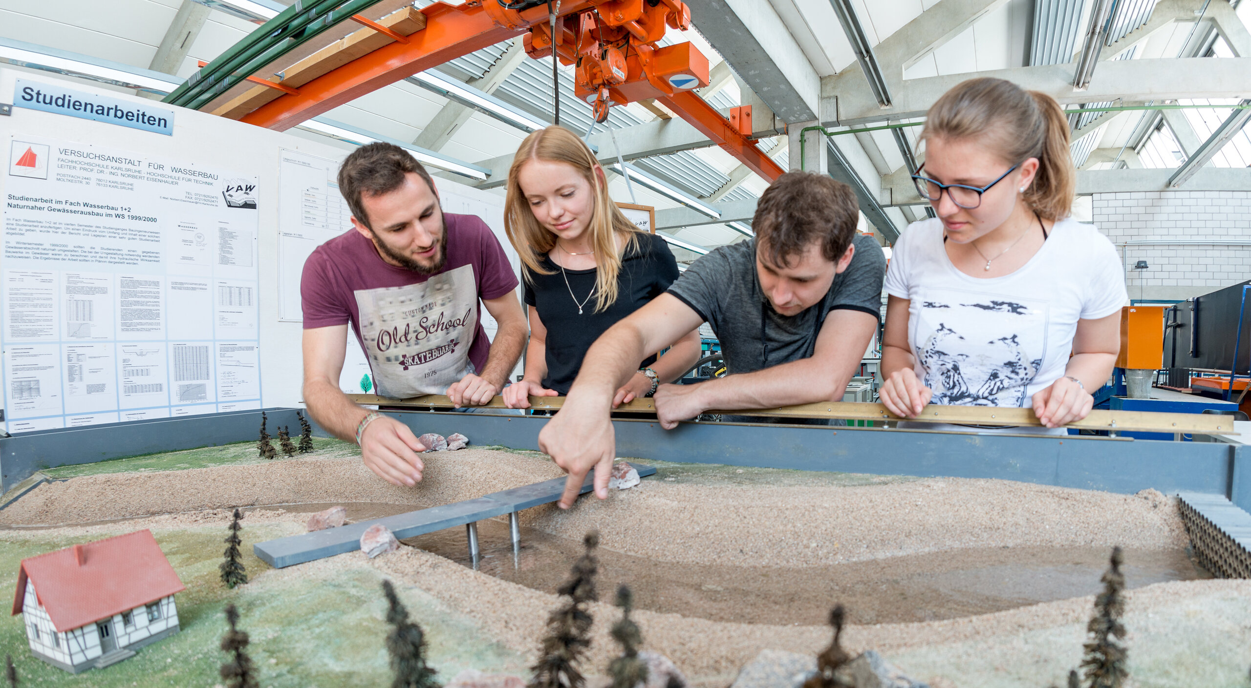 students at the lab preparing a model landscape