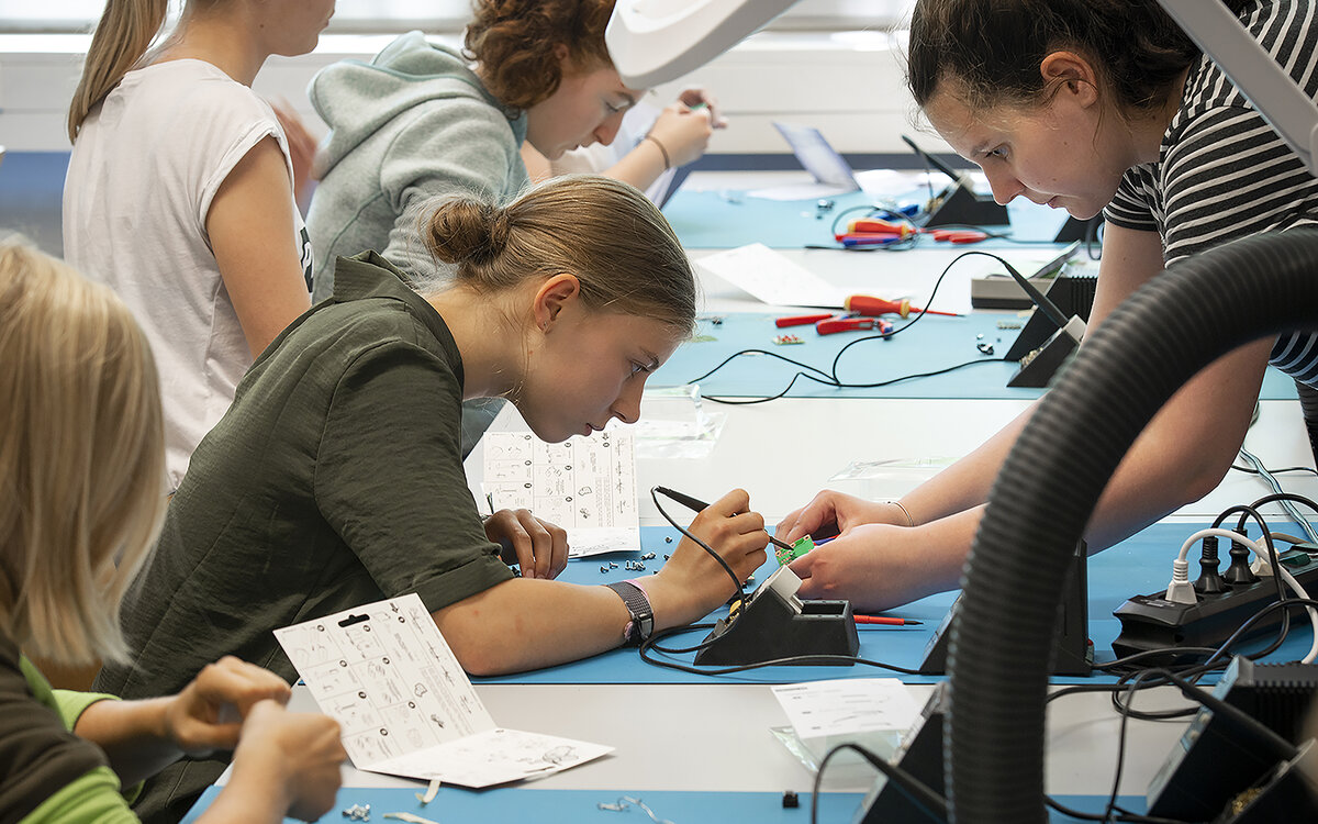 girls trying out measuring equipment girls trying out measuring equipment